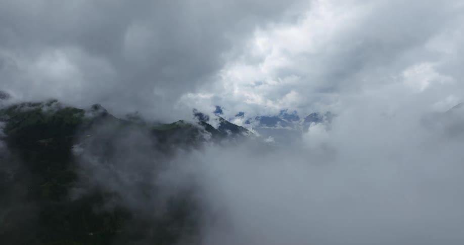 Clouds are covering the mountain range displayed