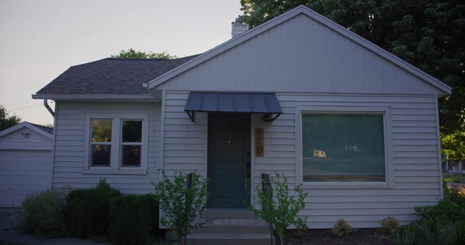 A view of a house in a neighborhood is displayed