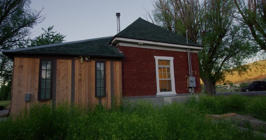 The view is of a small house located in a village around the day time