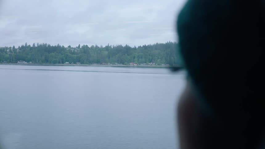 Close up of womans head looking at the lake