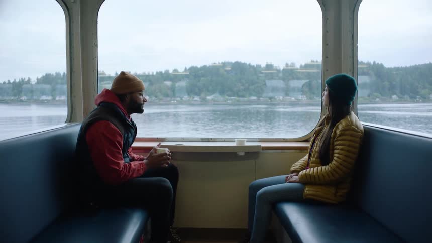 Two people are riding the ferry