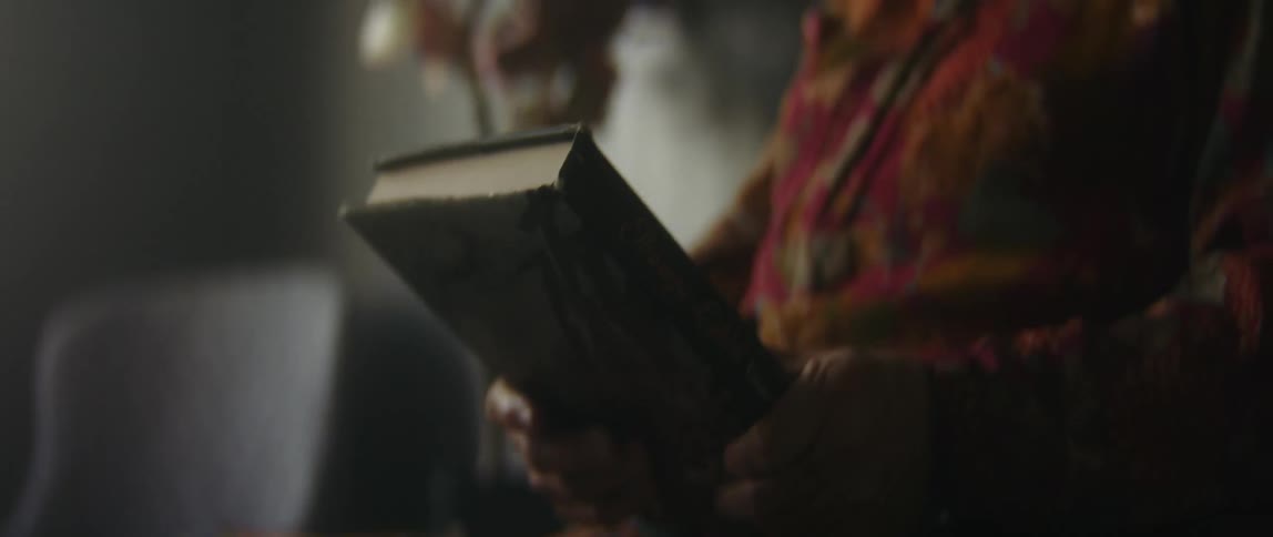 A person sitting around reading a book