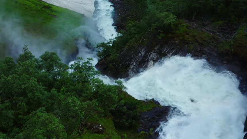 Aerial view of a waterfall during spring is displayed