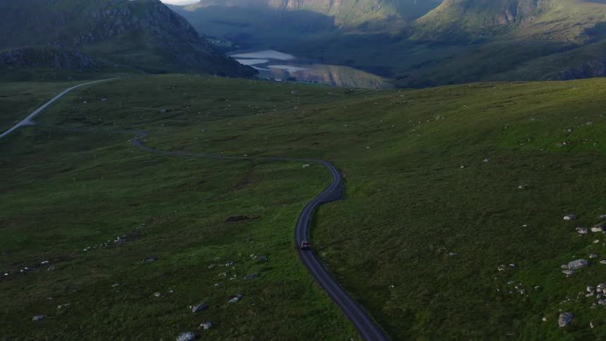 A person is driving a car through a rural area during spring