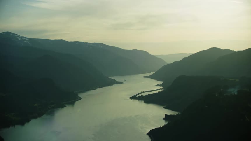 The Columbia River Gorge flows west through a beautiful scene where mountains and water collide in this aerial shot