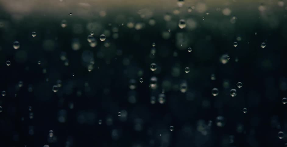 Bubbles are reflecting light as they float upwards in liquid