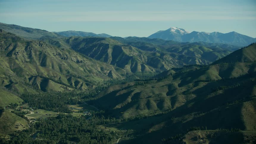 Aerial view of the Payette River drainage with many small carbon cubs flying up valley in Idaho