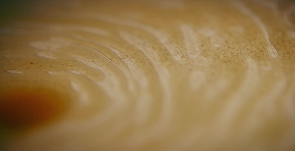 Surface of a latte swirls around