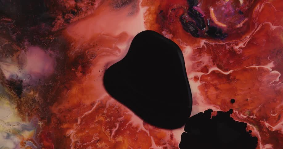 Black blobs expanding and floating above a sea of red