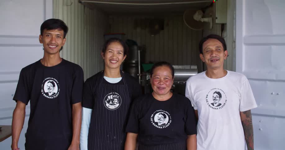 Restaurant workers pose outside