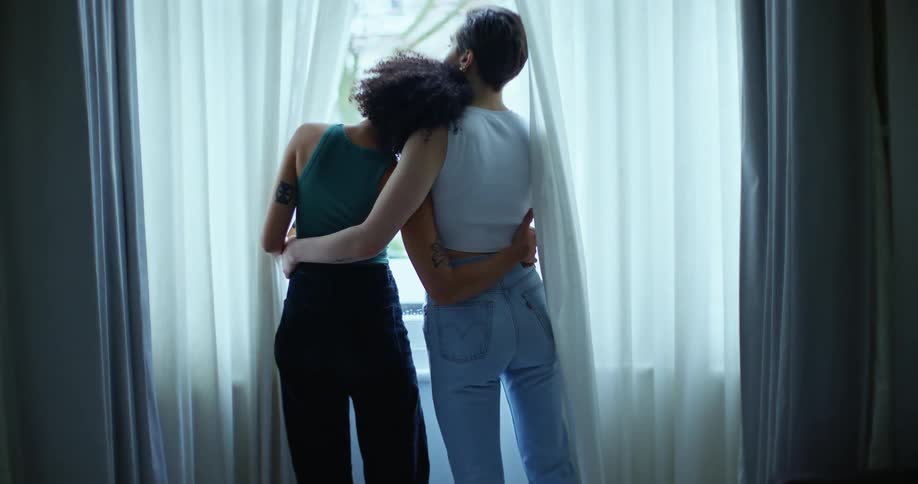 Two women hugging each other