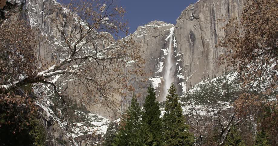 A waterfall in on a snowy mountain