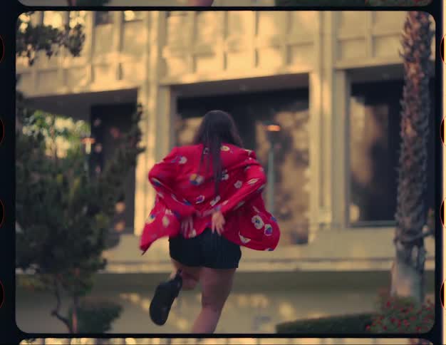 A woman is dancing outside