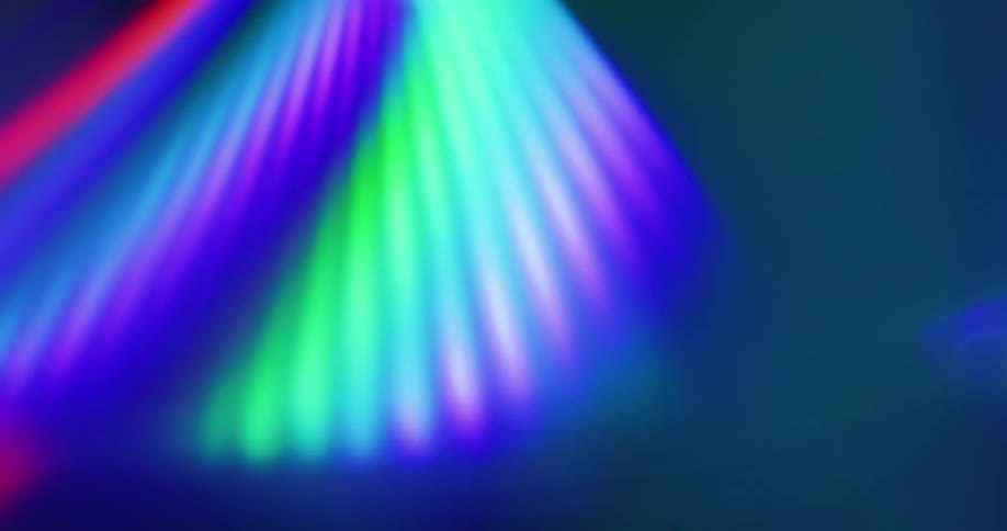 Neon lights flash on a chrome surface
