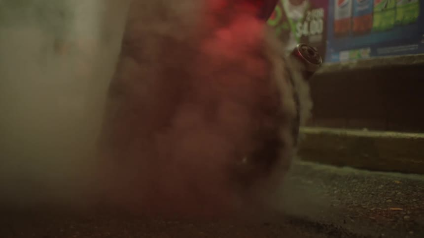A person burns out the tire on his motorcycle