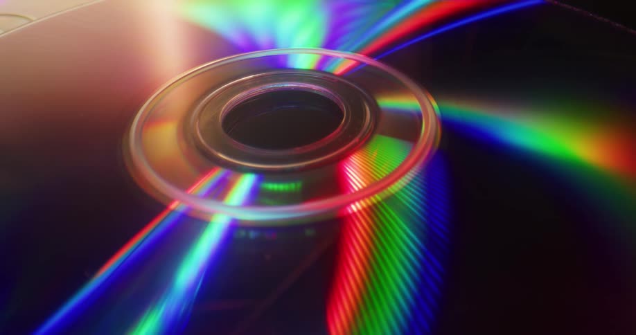 There is a compact disc and lights are flashing from it