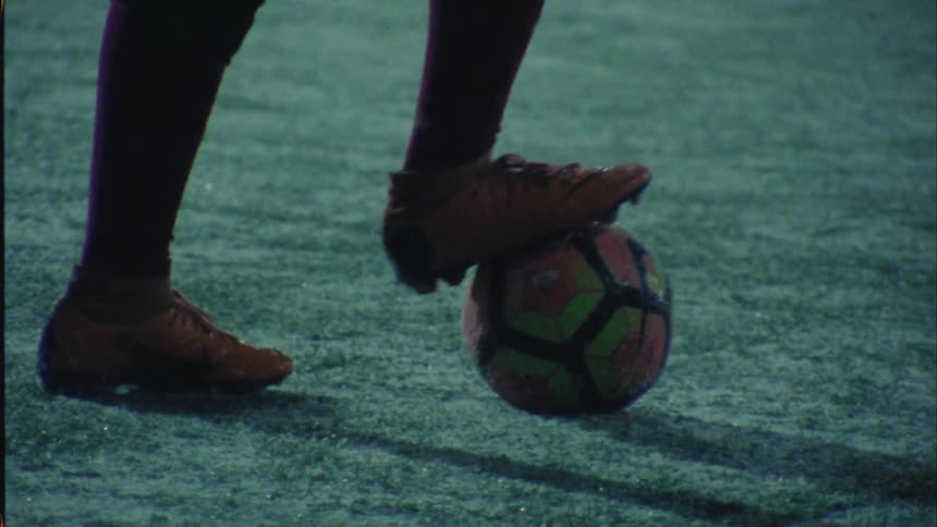 People are playing soccer at night