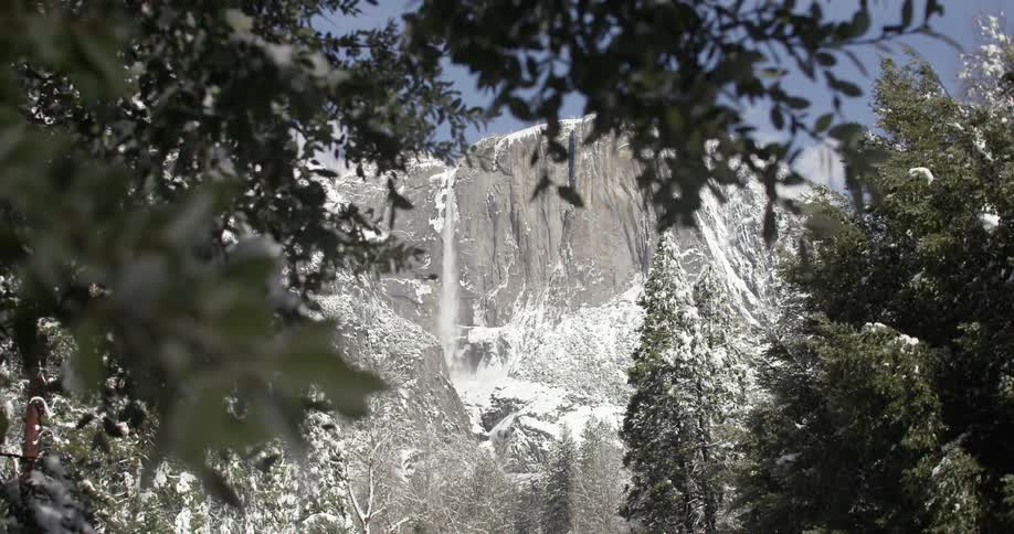 Bridalveil falls flows over its snow covered cliff