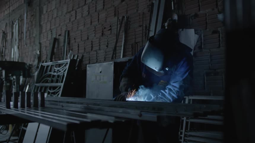 Sparks fly as a person welds