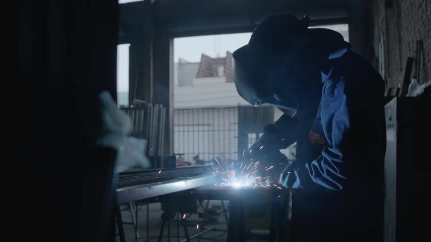 Sparks fly as an employee welds