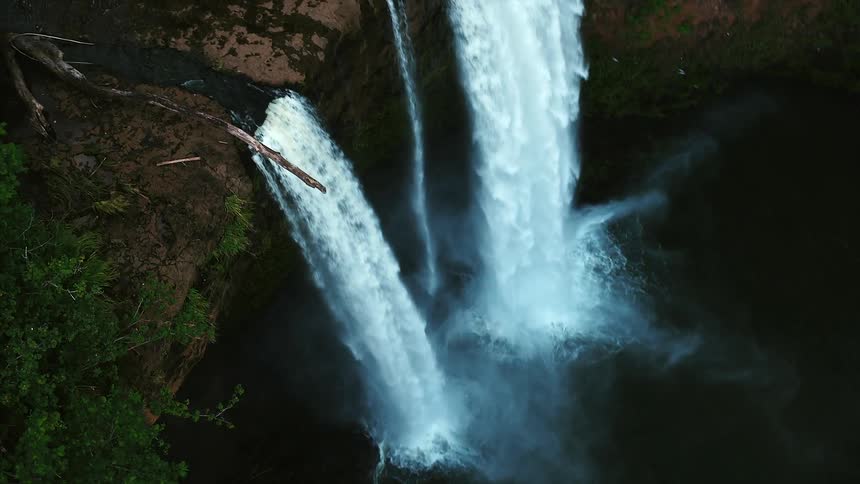 Waterfalls cascading into a lake