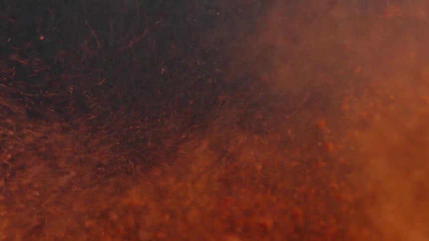 A thick layer of reddish sawdust is blown off the floor