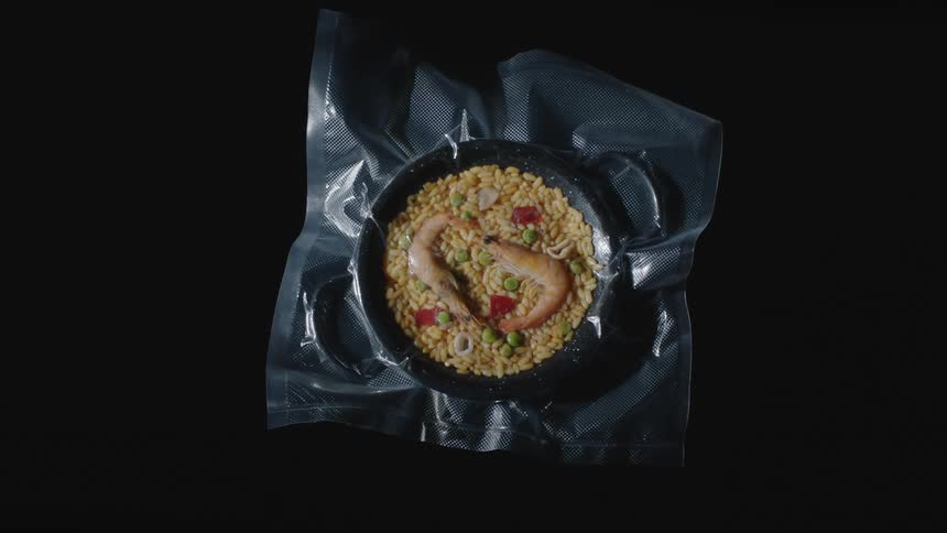 A bowl of food is on display at a table