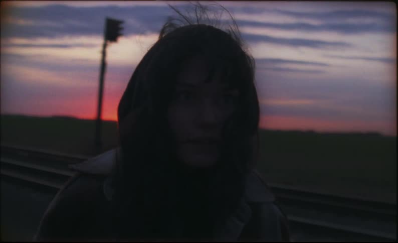 Two people arguing outdoors at sunset