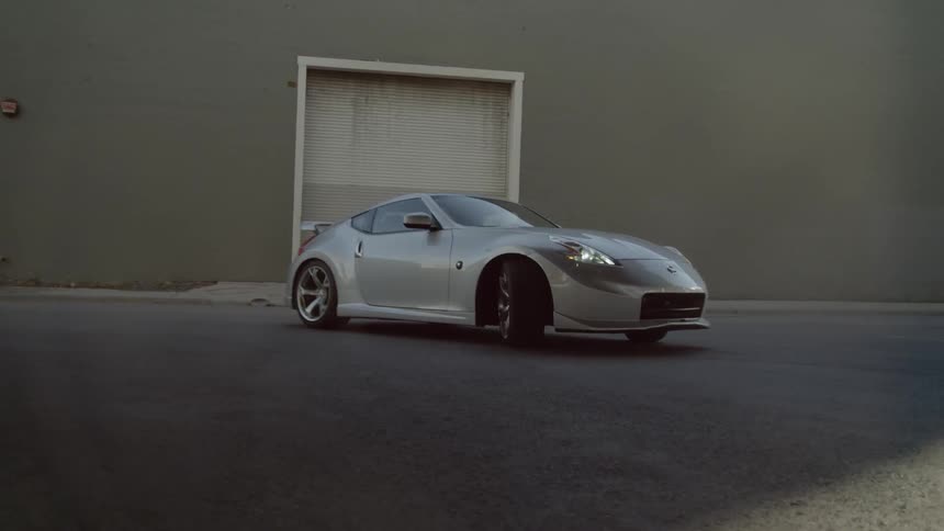 A car does donuts in the parking lot