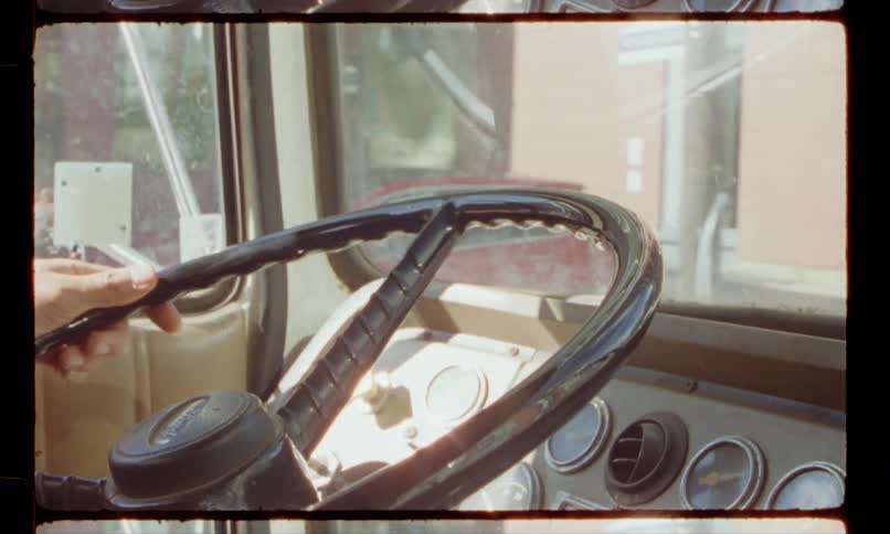 A man drives a truck through downtown