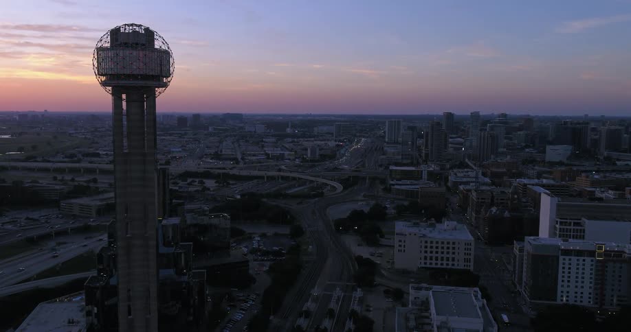 An aerial view of Reunion Tower in downtown Dallas, Texas, at sunset