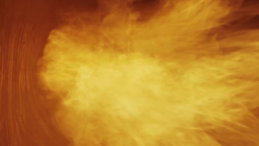 Flames shooting through a furnace before dying out