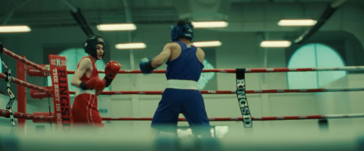 Two men are boxing in the ring