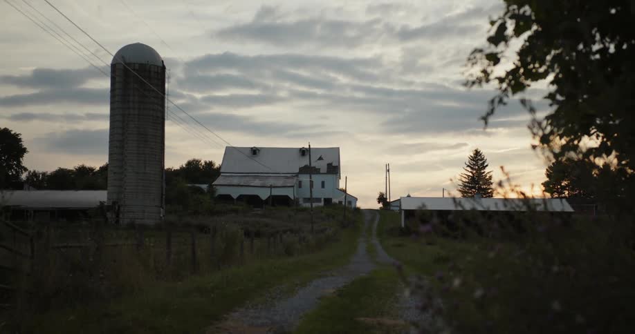 Clouds are rolling in over a farm