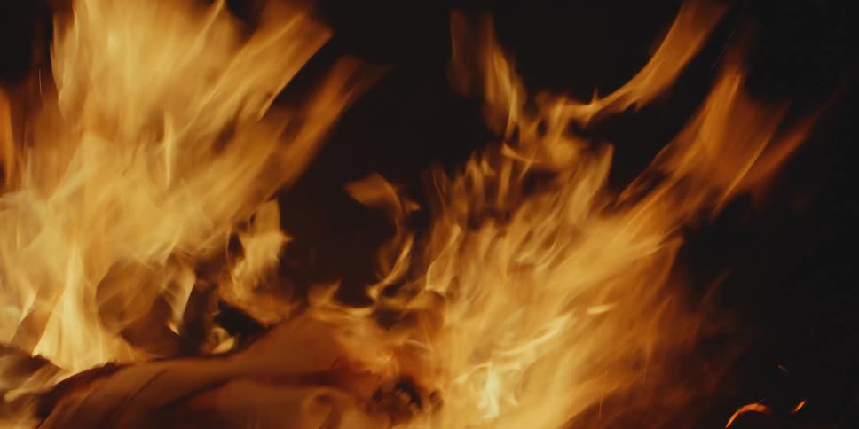 The logs are burning in the campfire