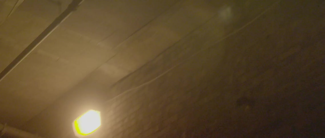 Lights line the top of this brick wall
