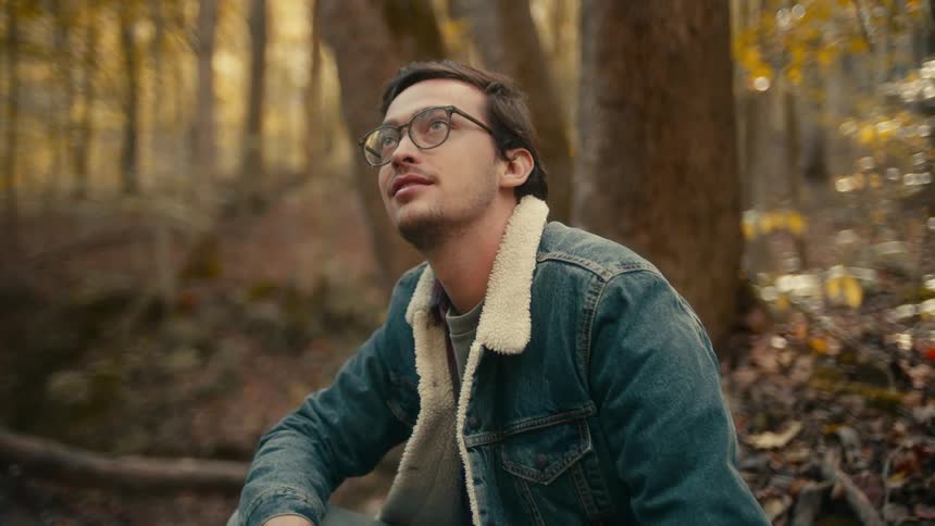 A man sitting in a forest