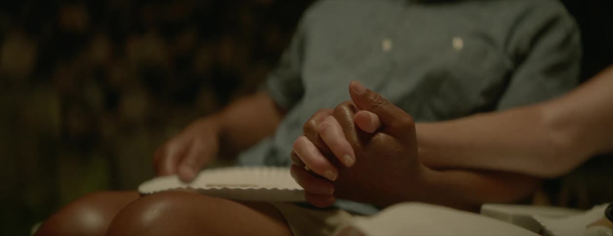 Two people holding hands