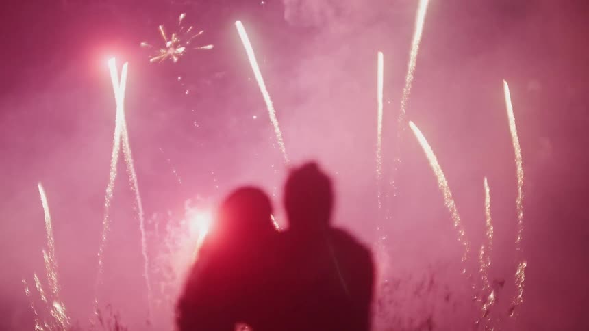A couple watch the fireworks