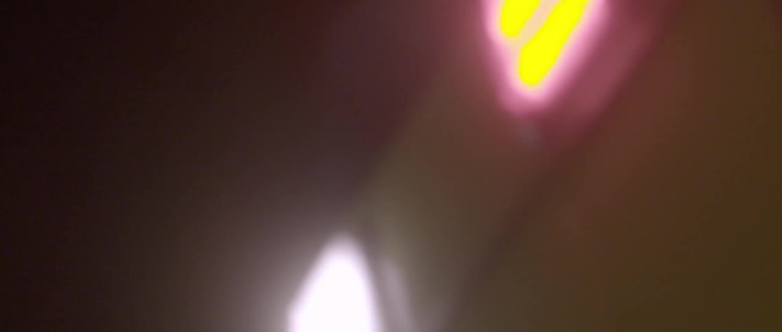 An ambulance lights are flashing at night