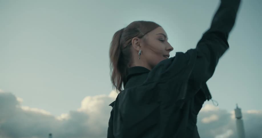 A woman dancing outdoors