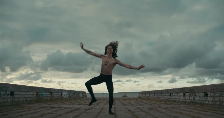 A woman dancing outdoors