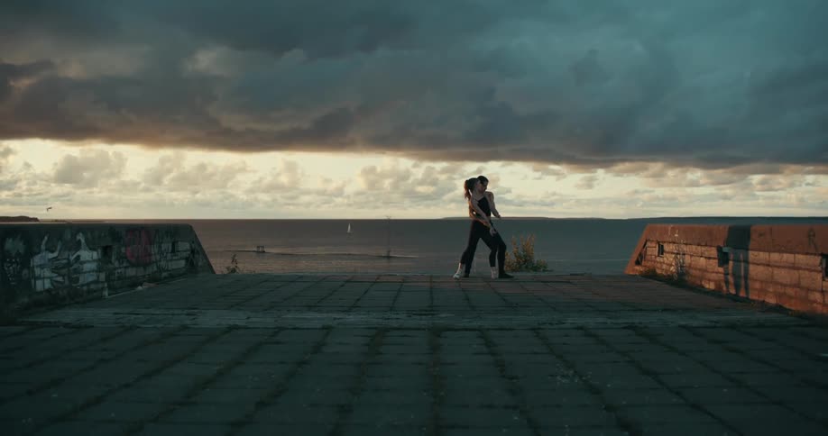 Two people dancing outdoors