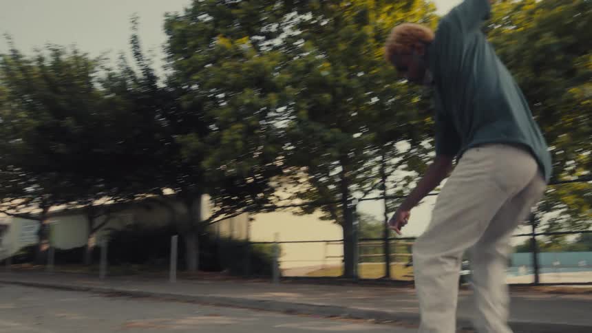 A man does a jump on his skateboard