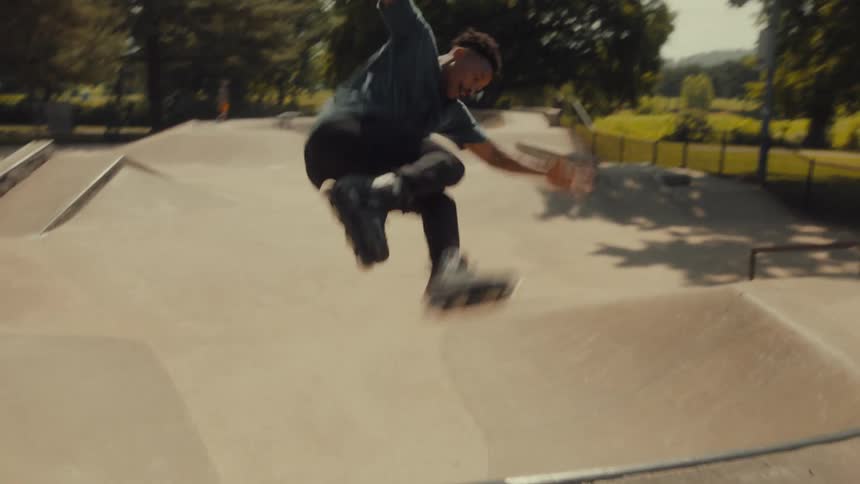 A man is rollerblading in the park