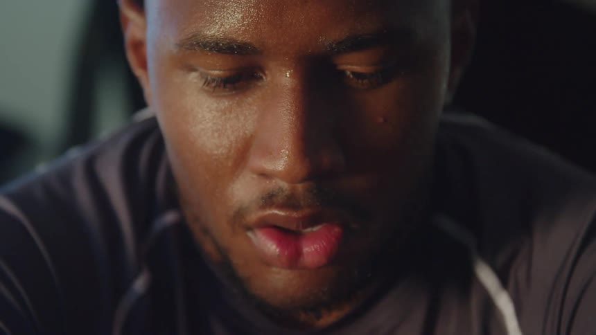 A man breathes heavy after exercising