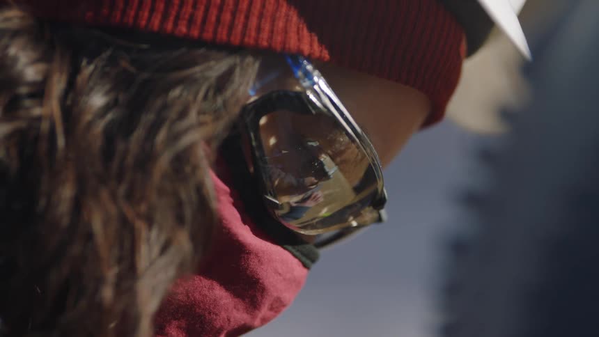 Close up of a woman with goggles and a hard hat on
