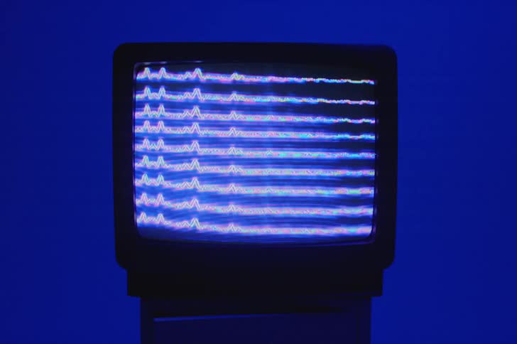 Blue static lines play on a television