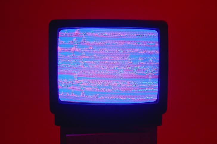 There is a television screen showing static on it