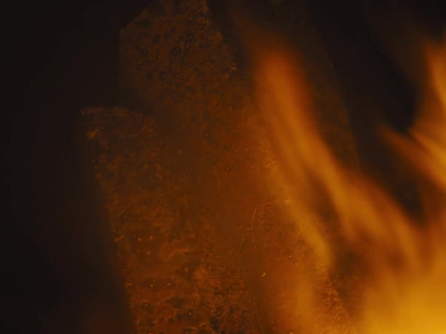Close up view of flames in a fire is displayed at night